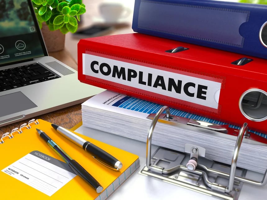 Red-Ring-Binder-with-Inscription-Compliance-on-Background-of-Working-Table-with-Office-Supplies-Laptop-Reports.-Toned-Illustration.-Business-Concept-on-Blurred-Background. Red-Ring-Binder-with-Inscription-Compliance-on-Background-of-Working-Table-with-Office-Supplies-Laptop-Reports.-Toned-Illustration.-Business-Concept-on-Blurred-Background.
